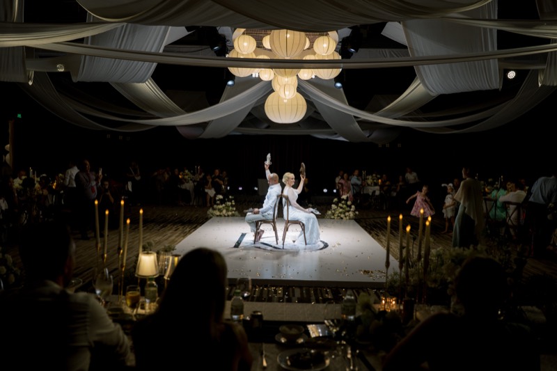 Guests dancing under string lights